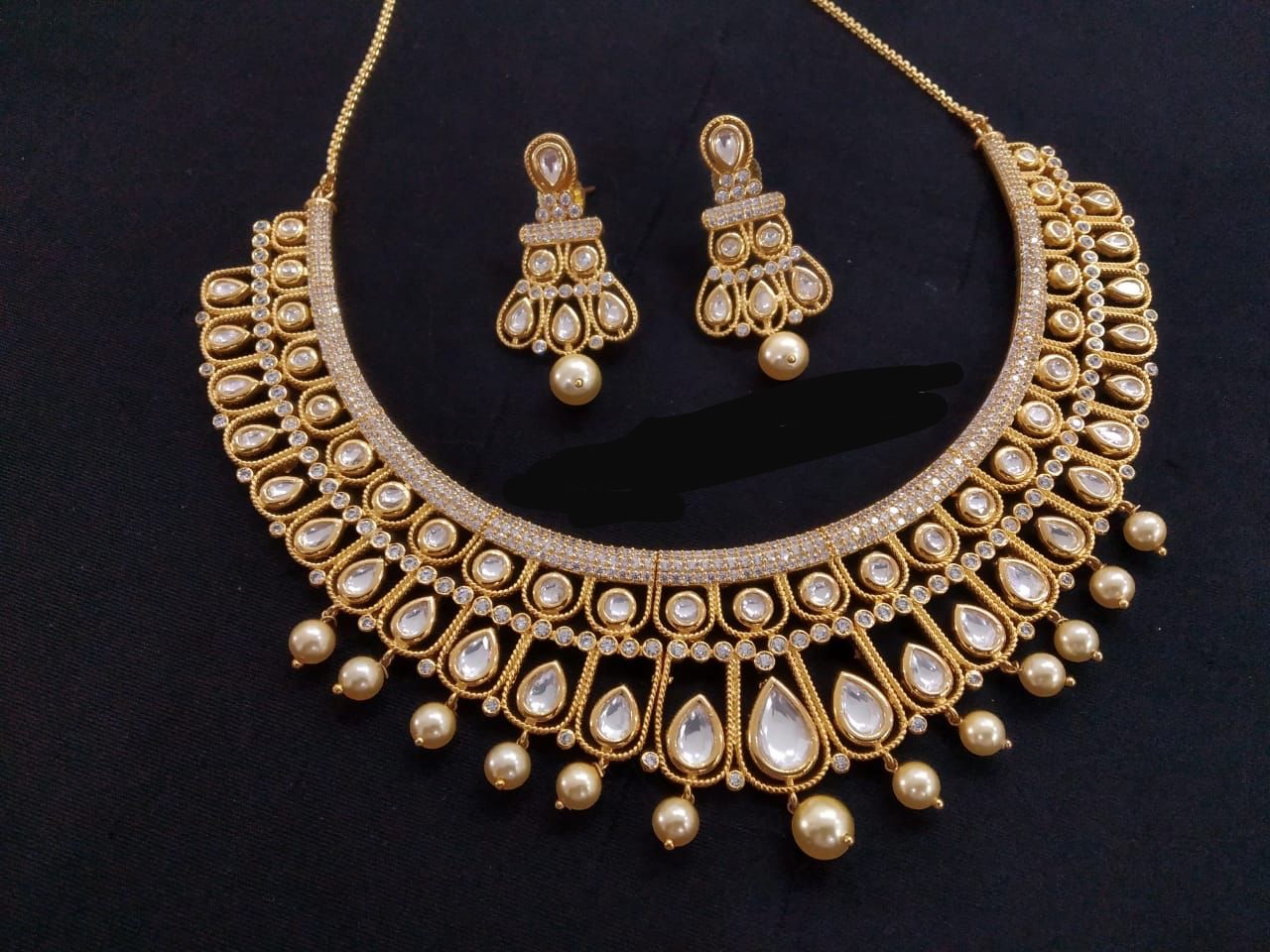 Delicate Uncut Foil Kundan Hasli Necklace Set - Clear